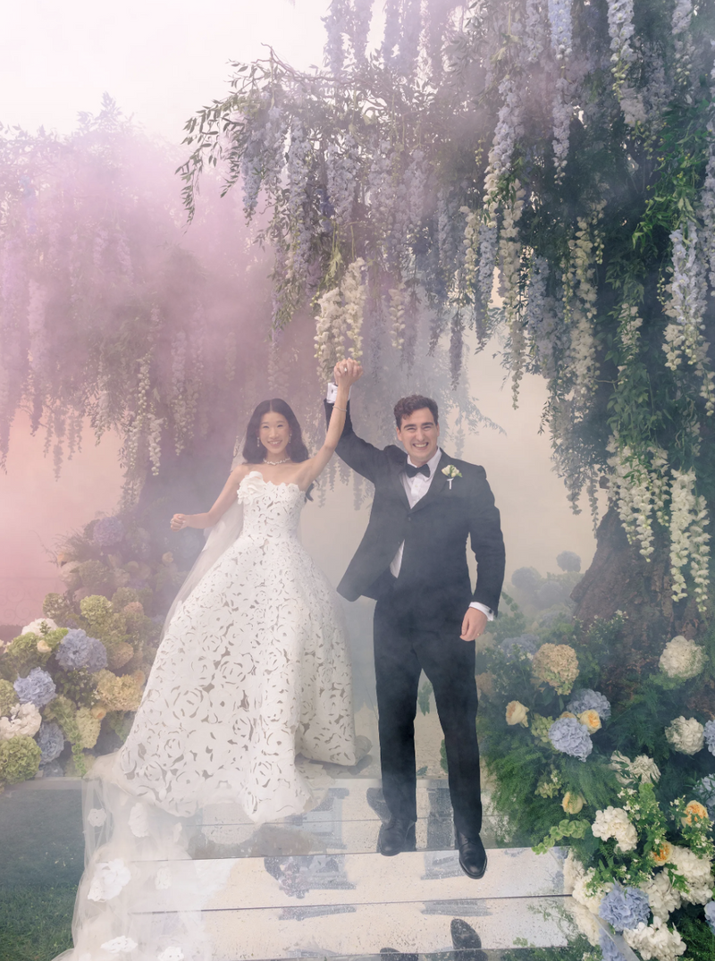 Rebecca Bloom walking down the aisle at Villa Balbiano in custom Oscar de la Renta wedding gown during Lake Como ceremony
