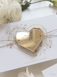Les roses romantiques sauvent la date avec un miroir doré aimant du coeur géométrique