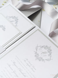 Suite per inviti di nozze tascabili con monogramma in argento scintillante